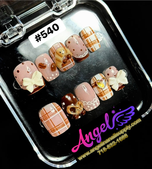 Set of decorative nail art designs in a clear case with 'Angel' branding.