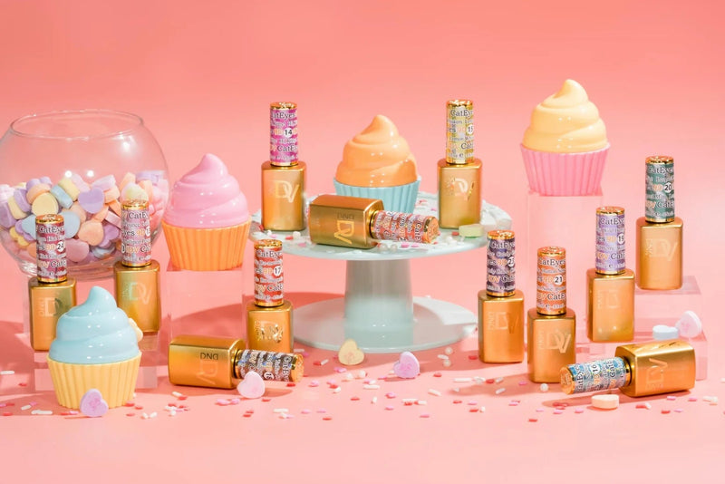 A collection of nail polish bottles in various colors, arranged in a visually appealing display with decorative elements like cupcake analogies in the background.